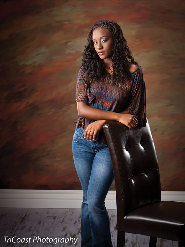 Soft golden swirls in an abstract sand-dune inspired backdrop.