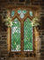 Gothic Window with Floral Arrangements Photography Backdrop - Gothic-style window photography backdrop with floral arrangements, featuring medieval stonework and green stained glass.