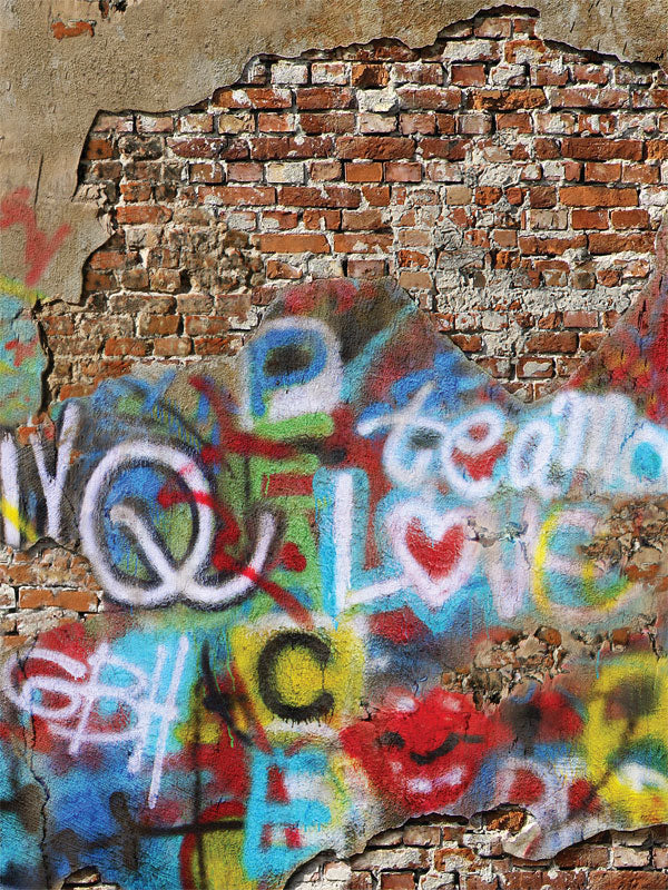 Urban brick wall with vibrant graffiti art and weathered textures, ideal for professional photography and street-style themed shoots.