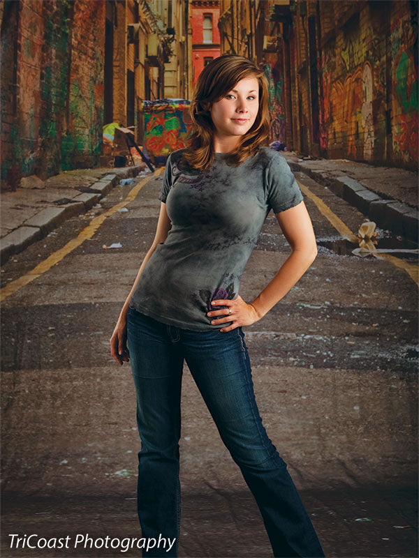 Photography backdrop showing tagged walls and urban decay.