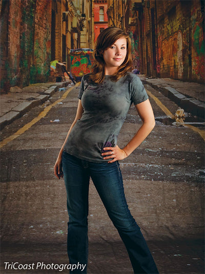 Photography backdrop showing tagged walls and urban decay.