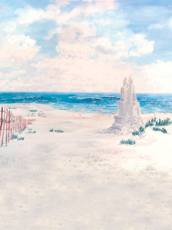 A scenic beach photography backdrop featuring soft sand dunes, gentle ocean waves, and a towering sandcastle.