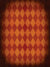 Halloween Vintage Harlequin Diamond Photography Backdrop - Vintage harlequin diamond backdrop with warm orange and red tones, perfect for photoshoots with a nostalgic or artistic theme.