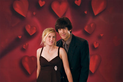 Valentine’s-inspired red backdrop with dimensional heart design.
