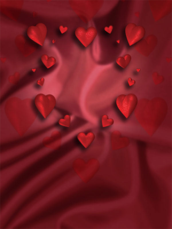 Romantic backdrop with floating red hearts over soft red folds.