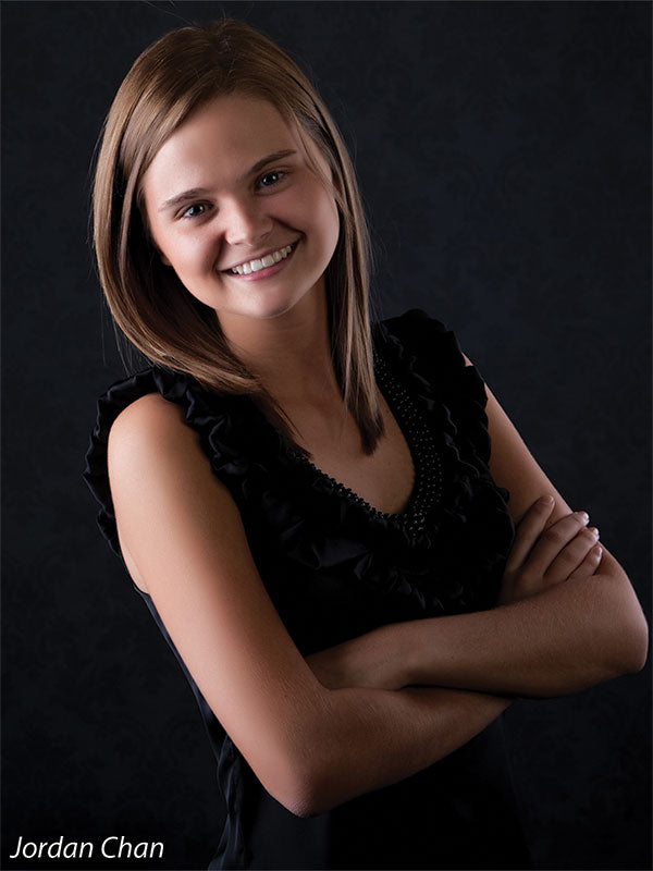 Textured black-on-black damask backdrop perfect for timeless portrait sessions