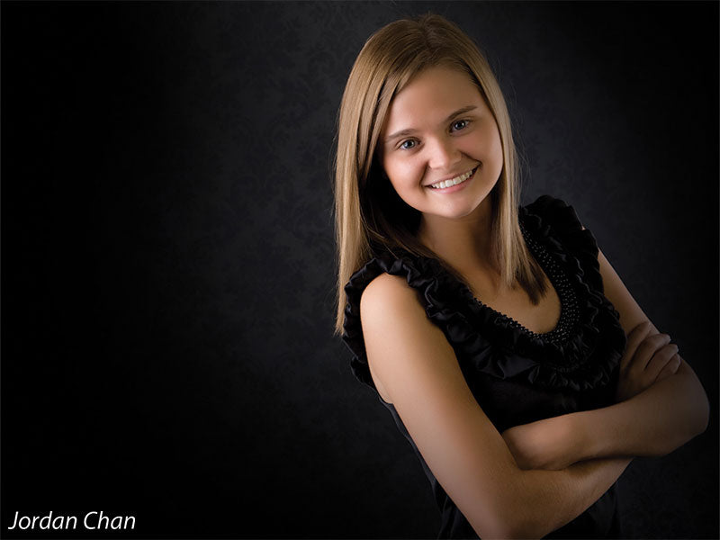 Classic dark damask backdrop with soft gradient, ideal for senior headshots