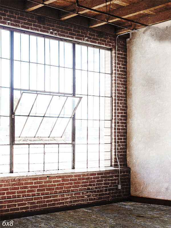 Industrial Loft Photography Backdrop - Industrial loft photography backdrop featuring exposed brick walls, large windows, and wooden beams.