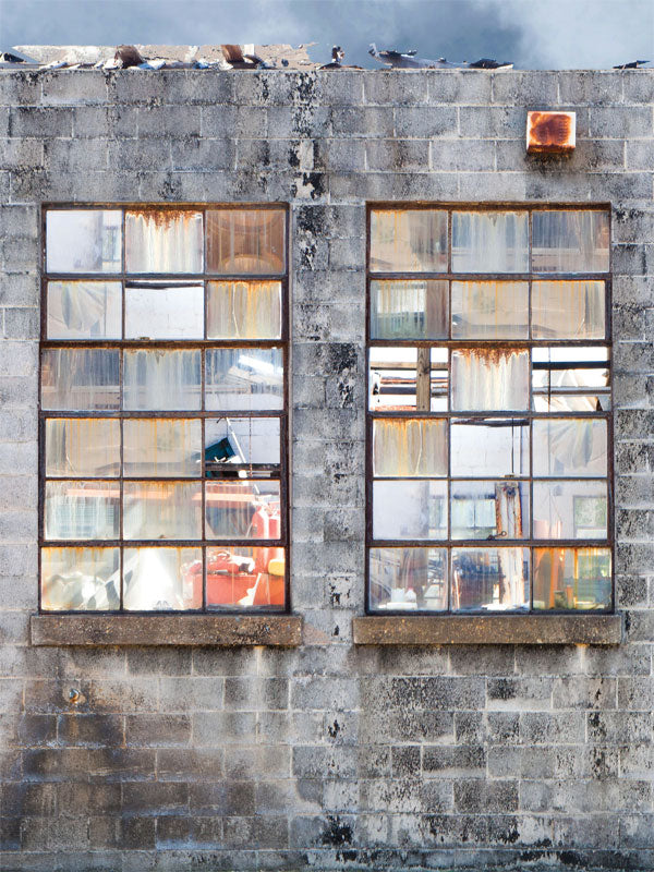 Industrial Warehouse Windows Photography Backdrop - A distressed industrial photography backdrop featuring rusted windows and weathered concrete, ideal for urban and grunge-themed photoshoots.