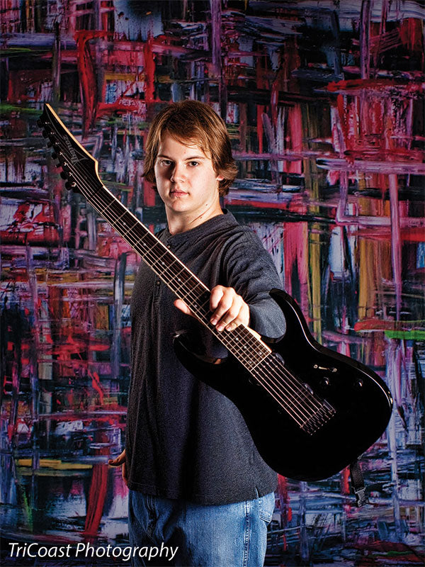 Photography backdrop with overlapping painted lines in a muted industrial color scheme.