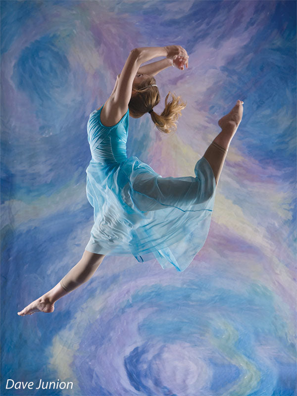 Painterly swirl backdrop with pastel tones and circular motion for artistic portraits.