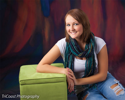 Kinetic motion effect backdrop with rich color transitions and dark framing.