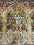 Majestic Gothic Arch Photography Backdrop - Intricately detailed Gothic arch with ornate patterns in gold and teal on a textured, aged background.