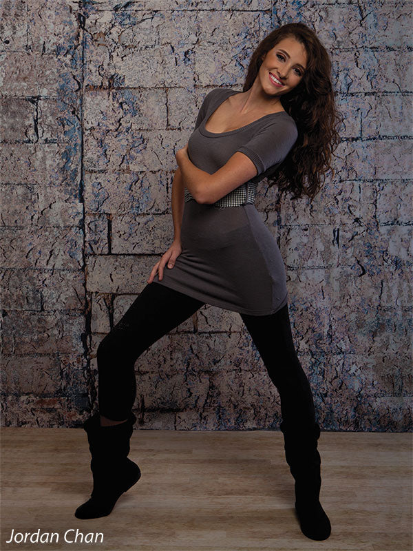 Neutral-toned rustic brick backdrop for versatile photo sessions.