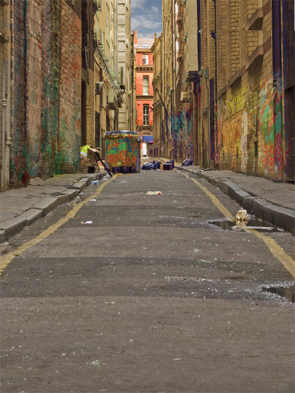 Urban alley backdrop featuring brick walls and colorful graffiti.