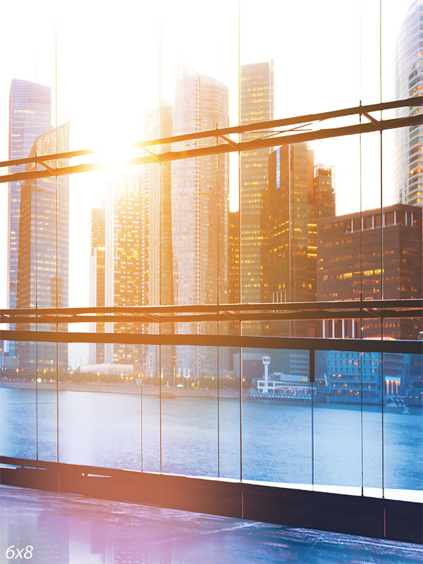 Modern City Skyline Photography Backdrop - Photography backdrop featuring a modern city skyline viewed through floor-to-ceiling windows at sunset.