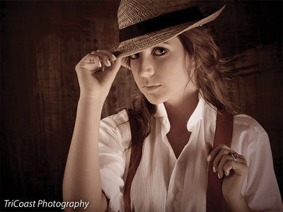 Backdrop featuring bronze, red, and worn painterly overlays.