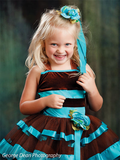Teal-toned abstract with mystical aura and vertical movement.
