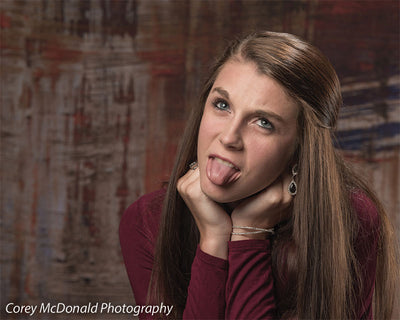 Backdrop featuring fire tones mixed with shadowy contrast.
