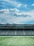 Open Stadium Field Photography Backdrop - Photography backdrop of an open stadium field, perfect for sports-themed photoshoots.