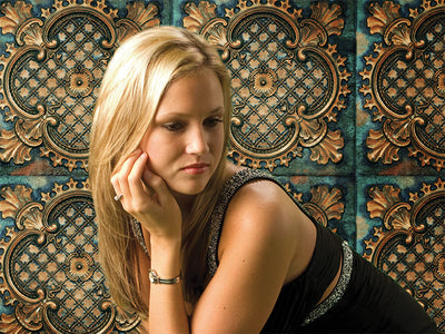 Ornate teal copper tile backdrop ideal for elegant senior or fashion photos