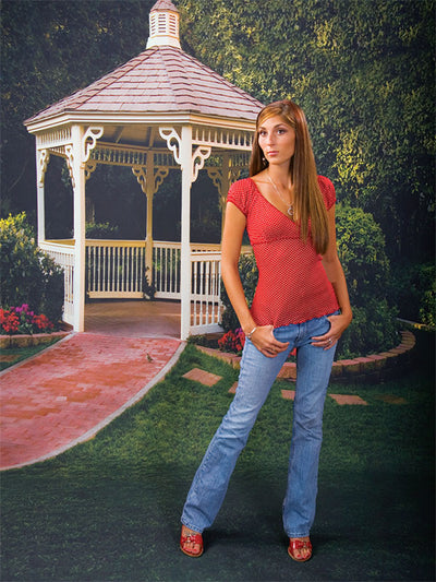 Classic outdoor scene featuring a white garden gazebo and inviting walkway.