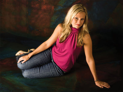 Studio backdrop with pastel tones and artistic color transitions for emotional depth.
