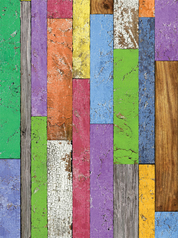 A rustic, multicolored wood plank photography backdrop with distressed paint for professional use in vibrant and creative photoshoots.