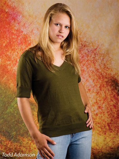 Painterly backdrop with layered brush-like patterns in fiery and earthy tones.