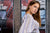 Tight crop portrait with red brick fire escape and loft backdrop—ideal for edgy senior and fashion photographers.