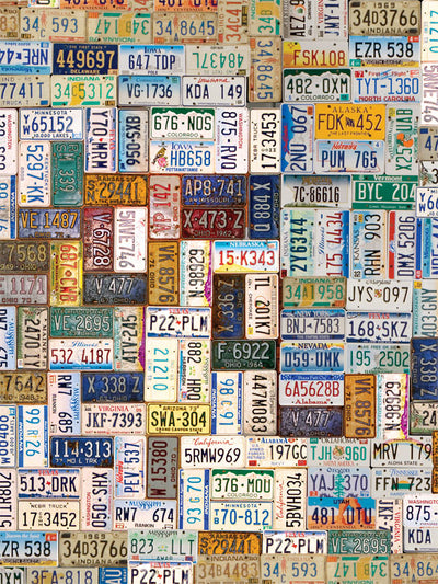 A backdrop of overlapping vintage U.S. license plates arranged in a colorful collage.