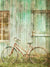 Rustic Bicycle and Wooden Barn Photography Backdrop - Vintage-style photography backdrop featuring a rustic red bicycle against an aged, weathered wooden barn background, perfect for professional photoshoots.