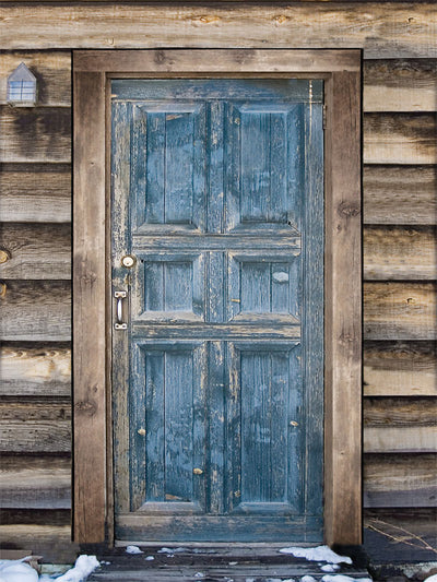 Rustic Blue Door Photography Backdrop - Photography backdrop featuring a weathered blue door framed by wooden beams with snow at the base.