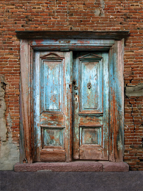 Rustic Blue Door Photography Backdrop - Rustic blue door photography backdrop with distressed red brick and weathered wooden doors, ideal for vintage and rustic-themed photoshoots.