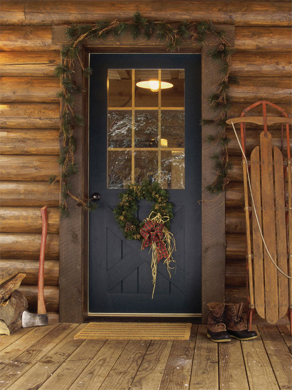 Rustic Cabin Christmas Door Photography Backdrop - Rustic Christmas photography backdrop featuring a cozy cabin door with a festive wreath and vintage sled for holiday photoshoots.