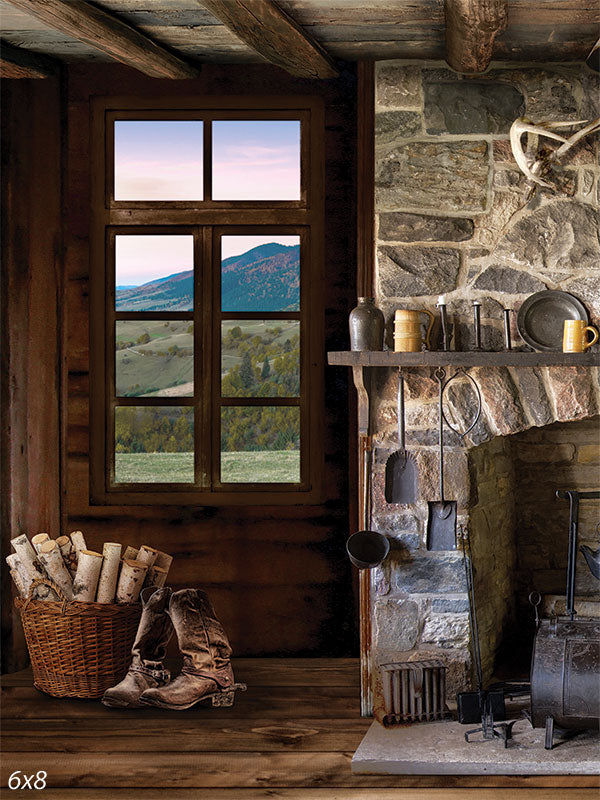 Rustic Cabin Fireplace Photography Backdrop - Photography backdrop of a rustic cabin interior with a stone fireplace and a window overlooking a mountain landscape.