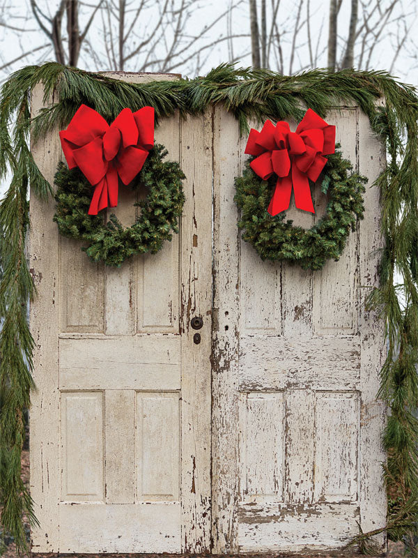 Rustic Christmas Door with Wreaths Photography Backdrop - A rustic holiday-themed photography backdrop featuring two vintage wooden doors adorned with wreaths and red bows, perfect for festive photoshoots.