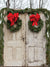 Rustic Christmas Door with Wreaths Photography Backdrop - A rustic holiday-themed photography backdrop featuring two vintage wooden doors adorned with wreaths and red bows, perfect for festive photoshoots.