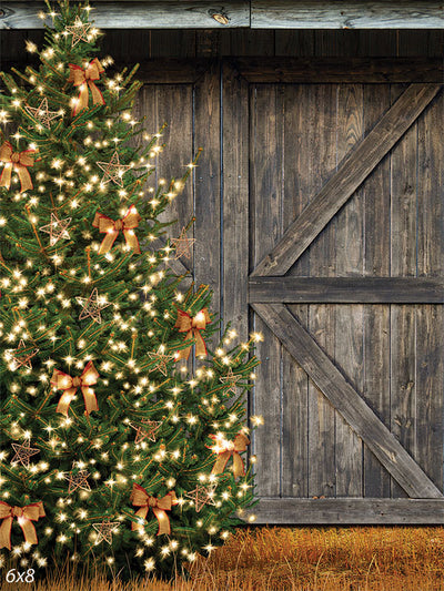 Rustic Christmas Tree with Lights Photography Backdrop - Christmas tree with glowing lights and decorations against a rustic wooden barn, ideal for holiday photography.