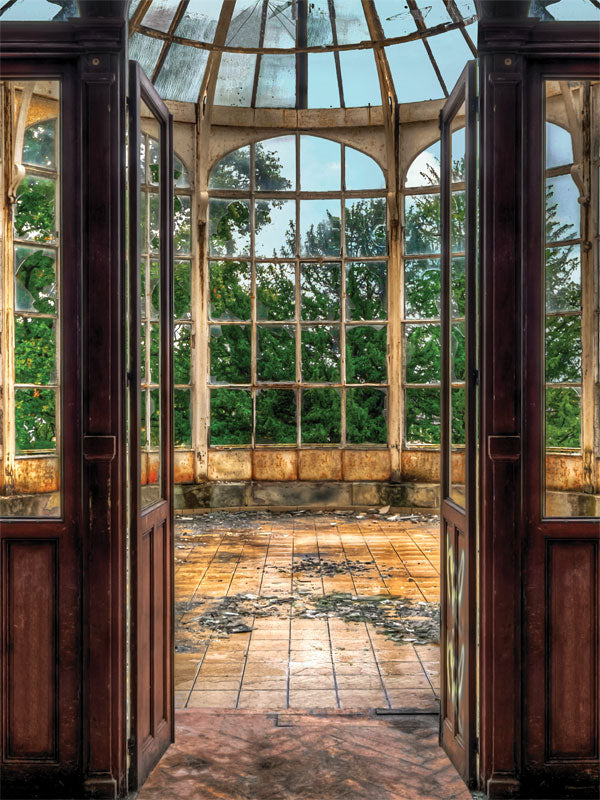 Rustic Greenhouse Photography Backdrop - Rustic greenhouse photography backdrop featuring aged windows, open doors, and a view of lush greenery for creative and vintage-themed photoshoots.