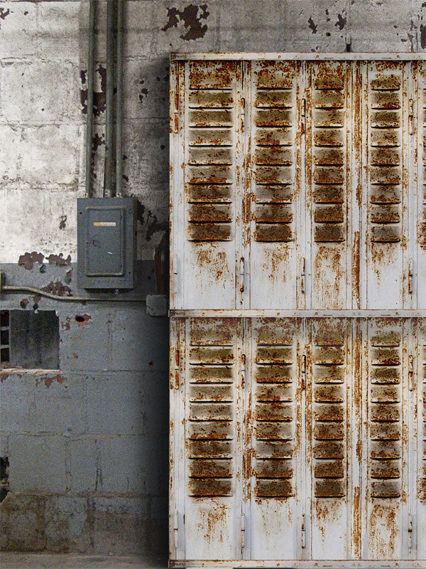 Rustic Industrial Locker Room Photography Backdrop - A photography backdrop featuring rusty industrial lockers and a worn concrete wall, ideal for urban-themed or edgy photoshoots.