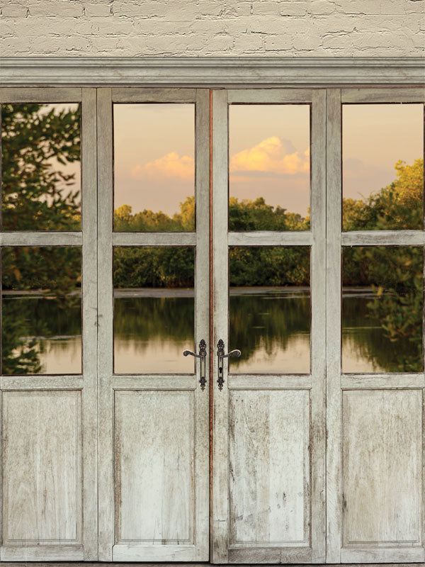 Rustic Lakeside Door Photography Backdrop - Rustic French doors opening to a serene lakeside view with a sunset, ideal for natural or rustic-themed photoshoots.