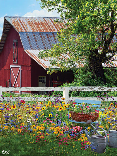 Rustic Red Barn with Flower Garden Backdrop - Photography backdrop of a rustic red barn with a vibrant flower garden in the foreground.