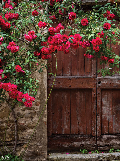 Rustic Rose-Covered Door Photography Backdrop - Rustic wooden door photography backdrop covered with vibrant red roses, perfect for romantic photoshoots.