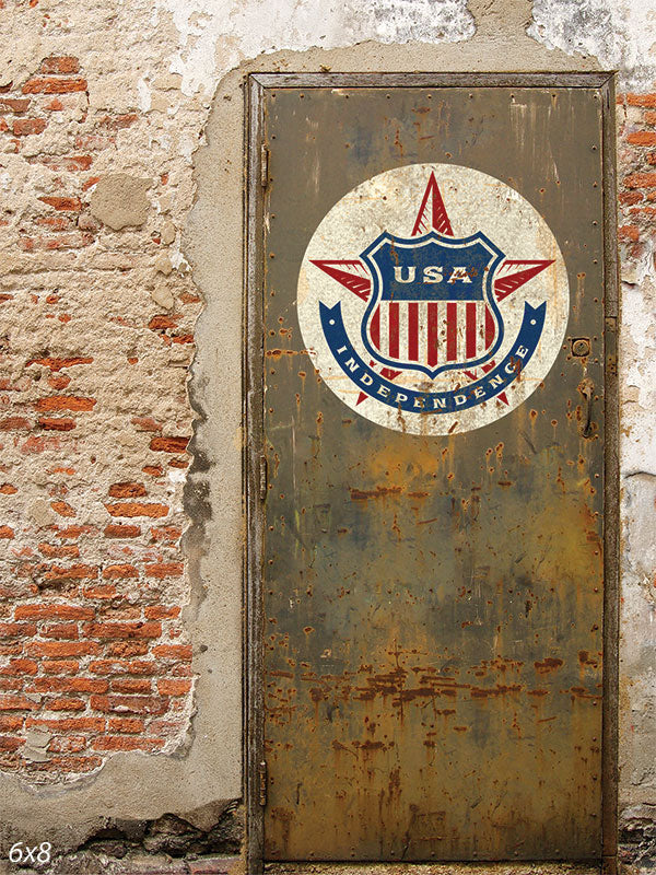 Rustic USA Independence Door Photography Backdrop - Weathered metal door with USA Independence emblem, set against a rustic brick wall, perfect for patriotic and vintage-style photography.