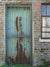 Rustic Weathered Door Photography Backdrop - Rustic photography backdrop featuring a weathered metal door in a brick wall setting, ideal for themed and industrial photoshoots.