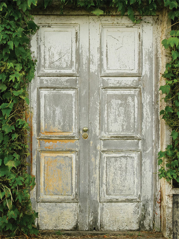 Rustic Wooden Door with Ivy Photography Backdrop - Rustic wooden door with distressed paint and overgrown ivy, creating a charming, vintage-style photography backdrop.