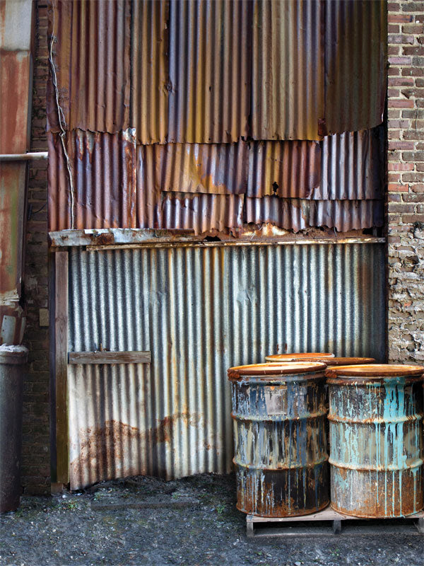 Rusty Industrial Metal and Barrel Photography Backdrop - A rusty metal and industrial photography backdrop featuring corrugated metal panels and weathered barrels, perfect for grunge or urban-themed photoshoots.