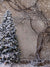 Snowy Tree and Branch Photography Backdrop - Winter-themed backdrop featuring a snow-covered Christmas tree and bare branches with a magical holiday atmosphere.