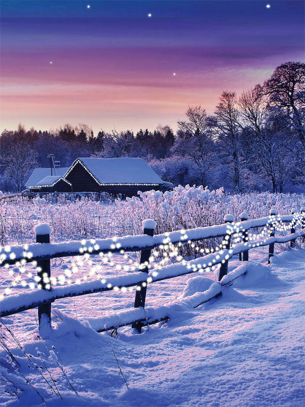 Snowy Twilight Cabin Photography Backdrop - Snowy cabin at twilight with a wooden fence and holiday lights, perfect for a winter photoshoot backdrop.